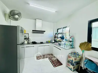 Modern kitchen with sleek appliances and ample storage space