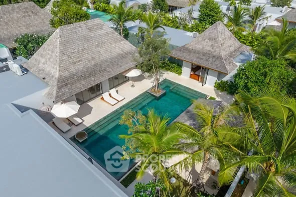 Luxurious tropical villa with private pool and lush greenery, perfect for serene living.