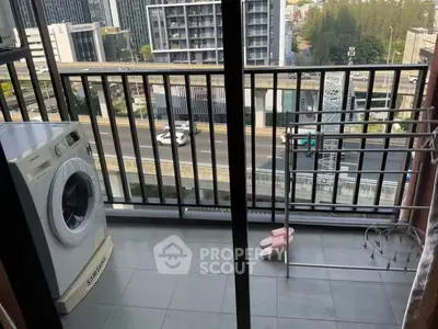 Modern balcony with washing machine and city view, perfect for urban living.