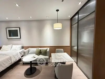 Modern studio apartment with cozy living area and stylish decor