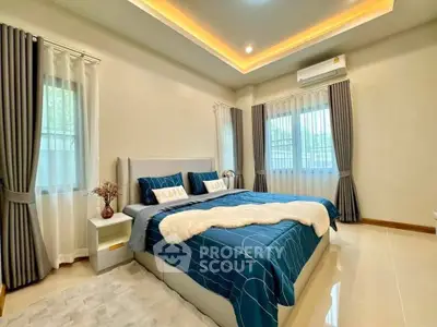 Luxurious bedroom with elegant decor and ambient lighting, featuring a plush bed and stylish curtains.