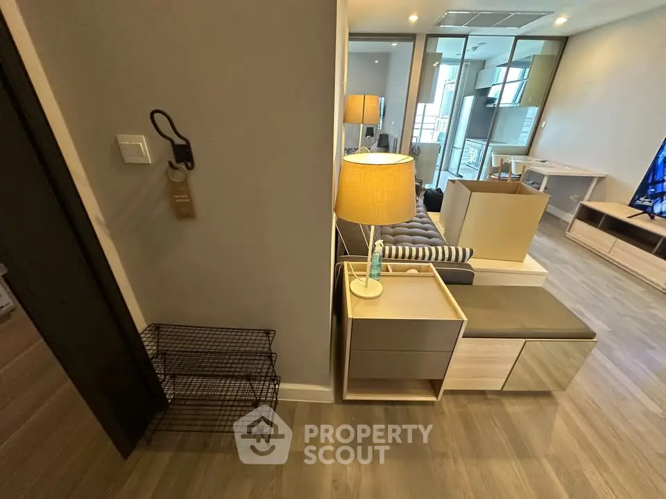 Modern living room with stylish furniture and open layout, featuring a cozy ambiance and contemporary design.