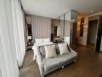 Luxurious bedroom with elegant decor and mirrored wardrobe in modern apartment