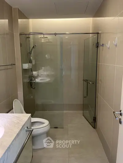 Modern bathroom with glass shower and sleek fixtures