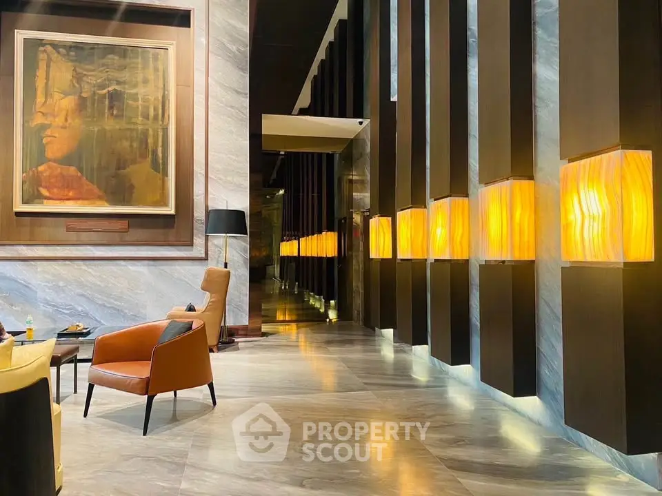 Luxurious hotel lobby with modern lighting and elegant seating area
