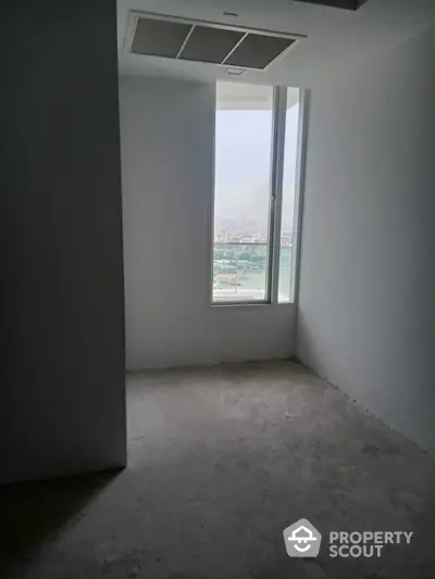 Minimalist empty room with large window and city view