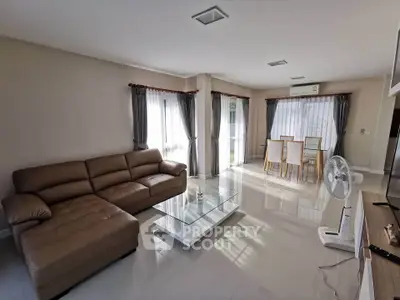 Spacious living room with modern furniture and natural light