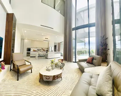 Luxurious open-plan living room with high ceilings and modern decor