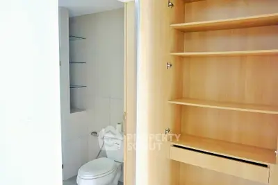 Modern storage space with sleek shelving and minimalist design.