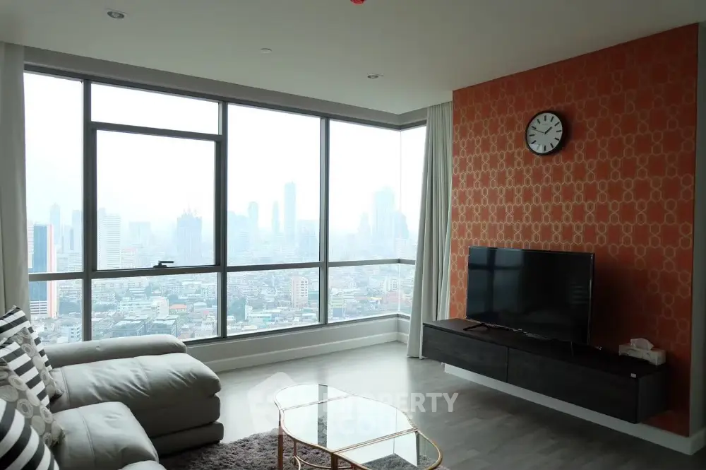 Modern living room with city view, stylish decor, and large windows