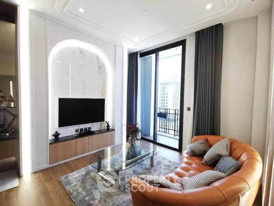 Luxurious living room with modern decor and large balcony access