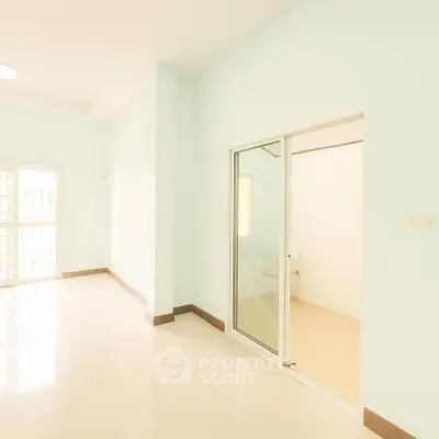 Spacious and bright interior with sliding doors and large windows, perfect for modern living.
