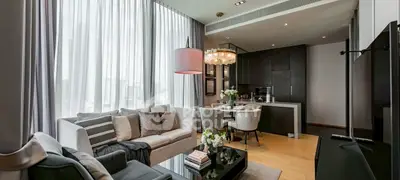 Luxurious modern living room with open kitchen and elegant decor