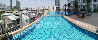 Luxurious rooftop infinity pool with stunning city skyline view