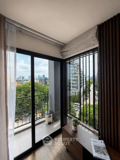 Chic urban balcony with stunning city view, perfect for relaxation and enjoying the skyline.