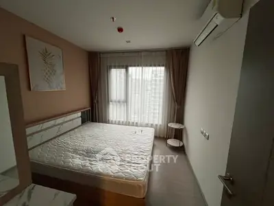 Modern bedroom with large window and minimalist decor