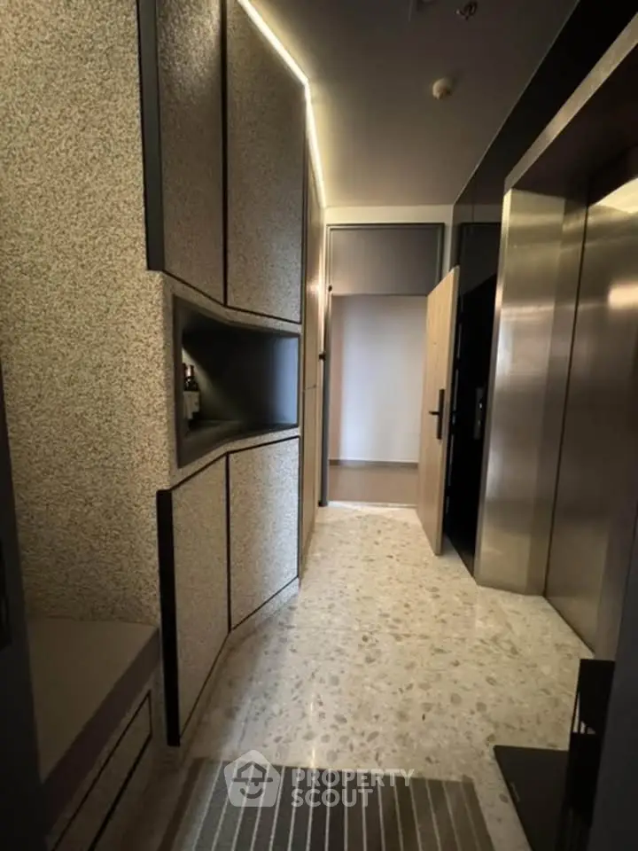 Modern apartment entrance with sleek elevator and stylish design