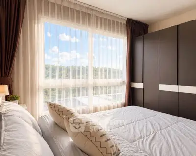 Bright and cozy bedroom with large window offering scenic views, modern wardrobe, and elegant decor.
