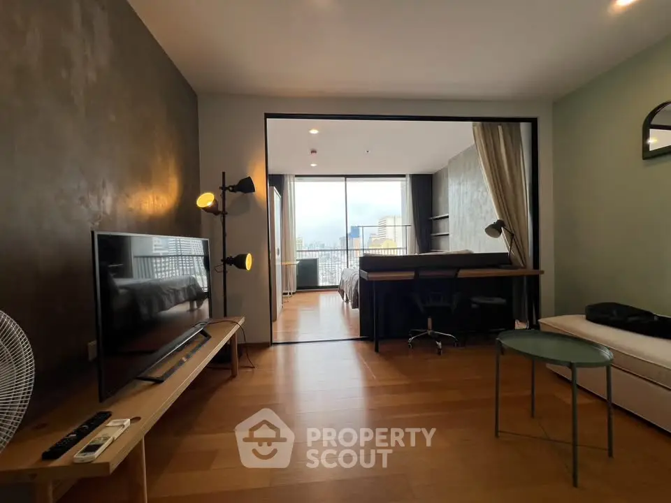 Modern open-plan living room with stylish decor and city view