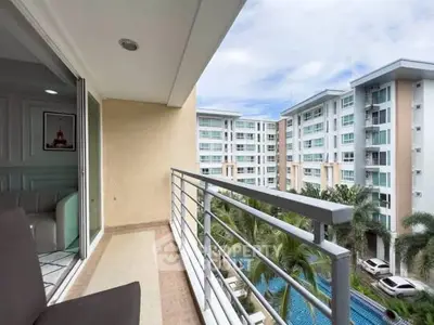 Modern condo balcony with pool view in a high-rise building