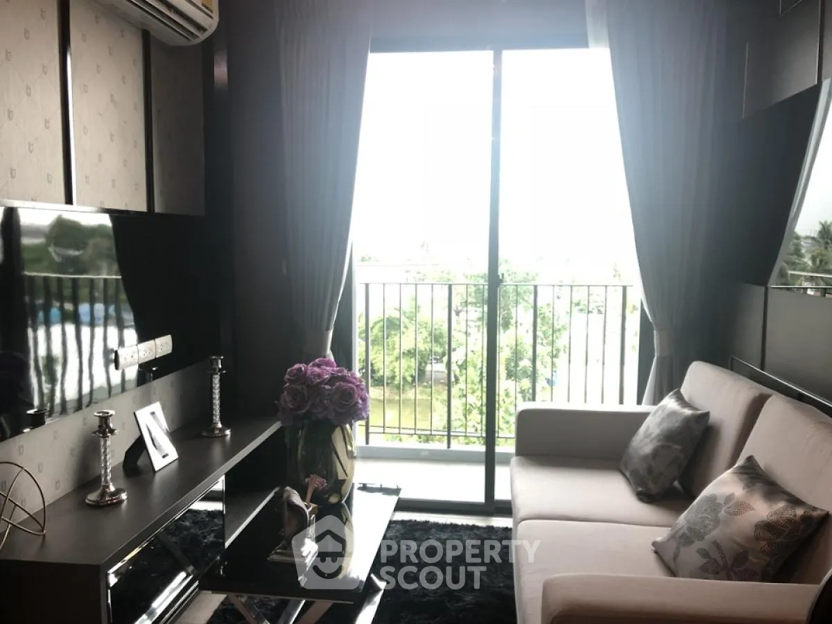 Stylish living room with balcony view and modern decor