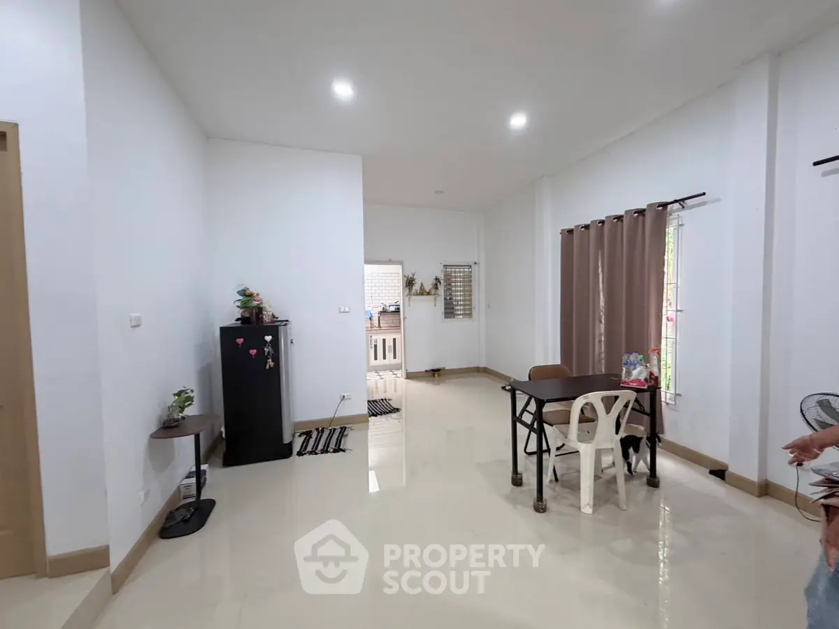Spacious living room with modern decor and natural light