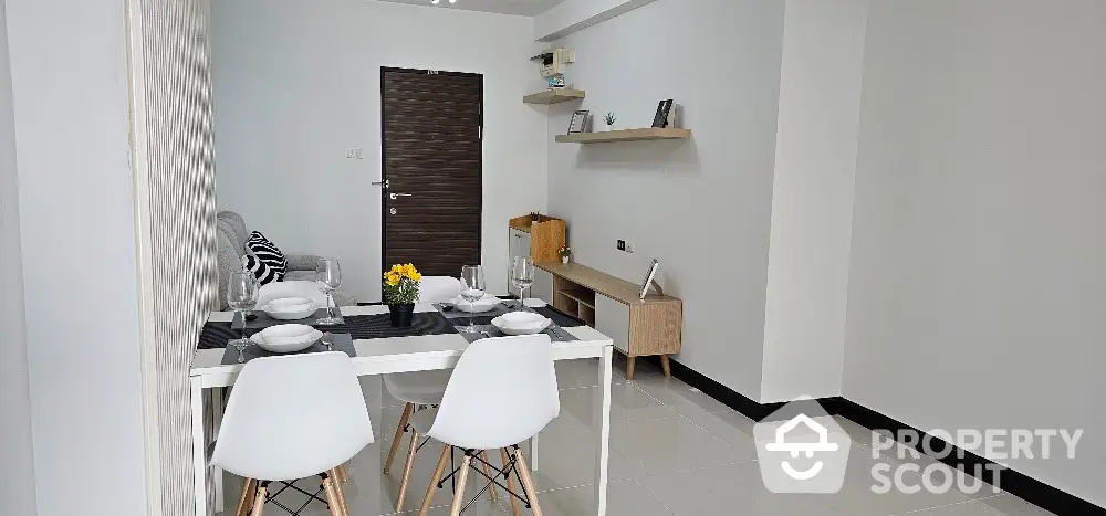 Modern dining area with stylish decor and minimalist furniture in a contemporary apartment.