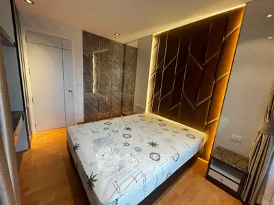 Luxurious bedroom with modern design and ambient lighting