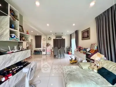 Spacious living room with modern decor and ample natural light