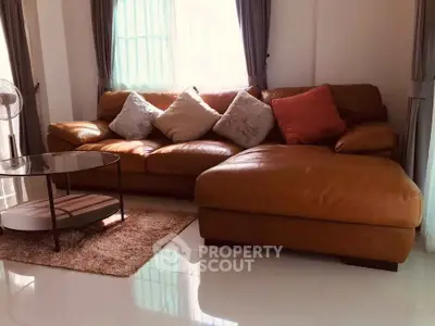 Cozy living room with plush leather sofa and stylish coffee table