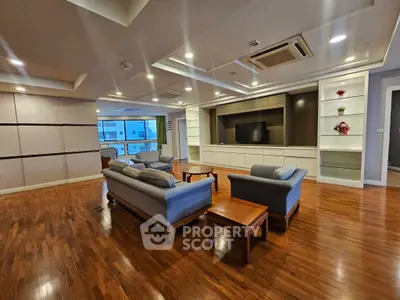 Spacious modern living room with elegant wooden flooring and stylish furniture