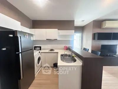 Modern kitchen with sleek appliances and open layout in stylish apartment