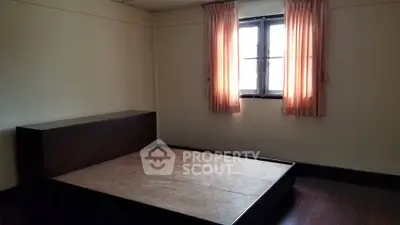 Minimalist bedroom with platform bed and natural light