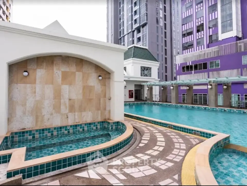 Luxurious apartment complex with stunning pool and modern architecture