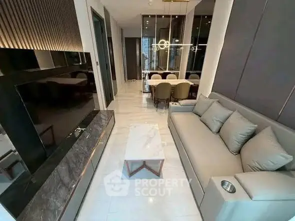 Luxurious modern living room with sleek design and elegant dining area