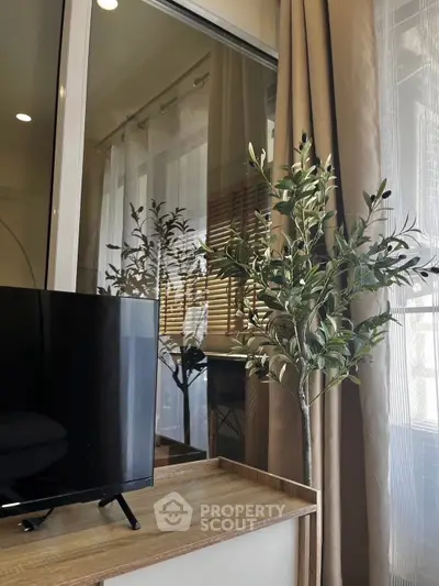 Modern living room with stylish decor and large window view