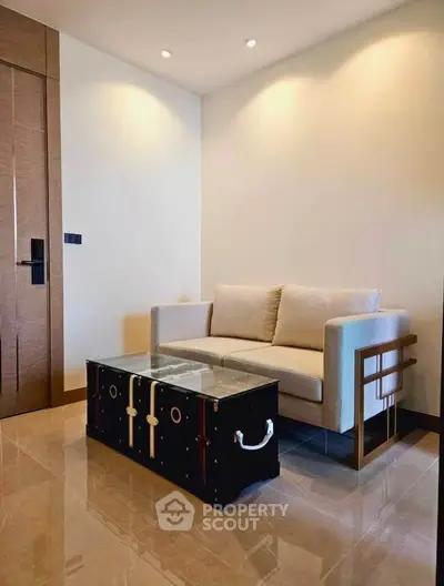 Modern living room with stylish sofa and unique trunk coffee table