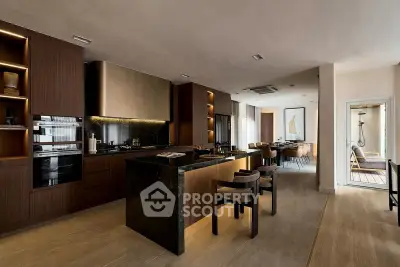 Luxurious open-layout kitchen with modern appliances and elegant dining area, perfect for entertaining.