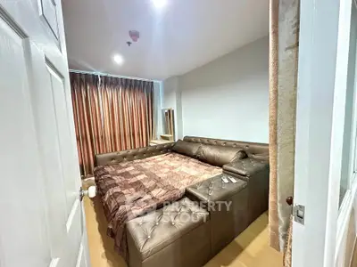 Cozy bedroom with leather sofa bed and elegant curtains