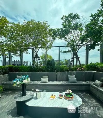 Luxurious rooftop terrace with elegant seating and lush greenery