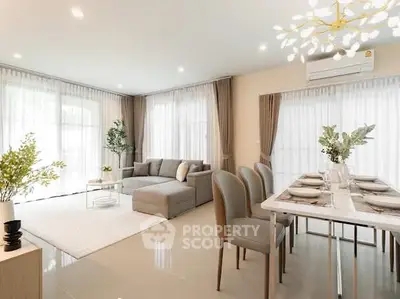 Spacious modern living room with elegant dining area and natural light