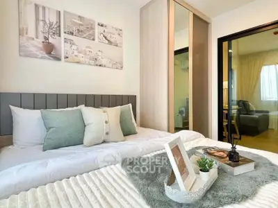 Cozy bedroom with modern decor and soft lighting, featuring a comfortable bed and stylish artwork.