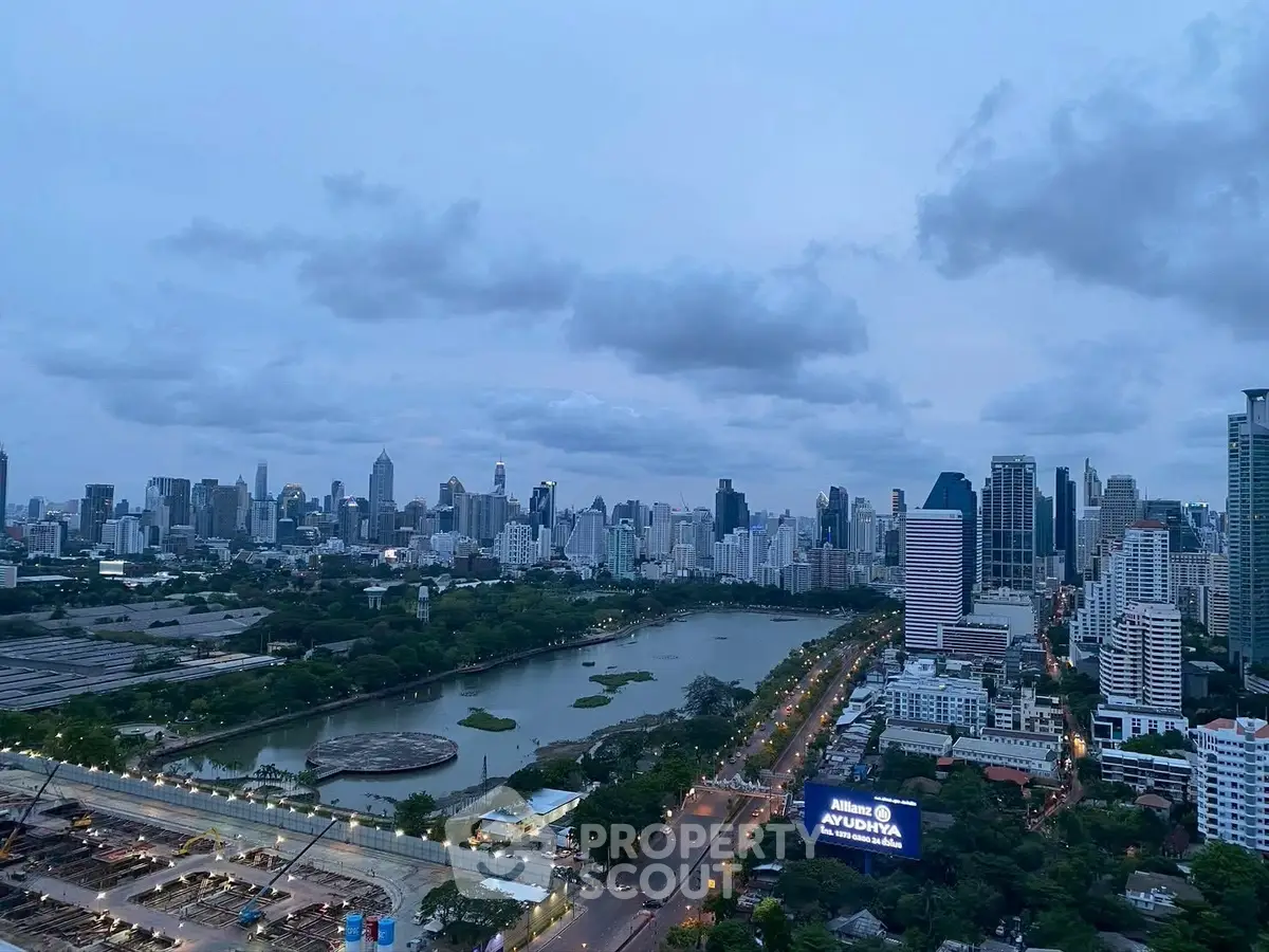 Stunning cityscape view with lush park and skyline at dusk, perfect for urban living enthusiasts.