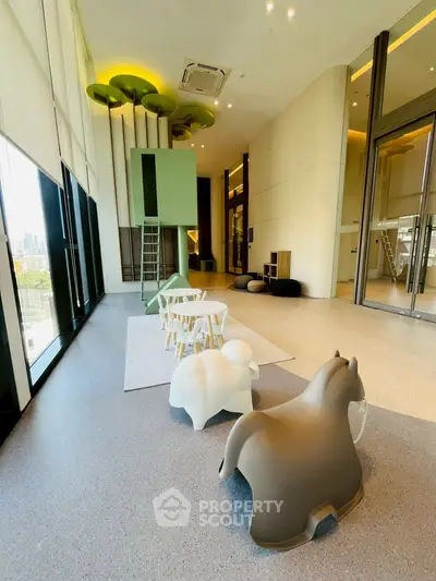 Spacious modern living room with high ceilings and playful decor