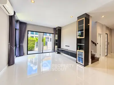 Spacious modern living room with large windows and sleek design