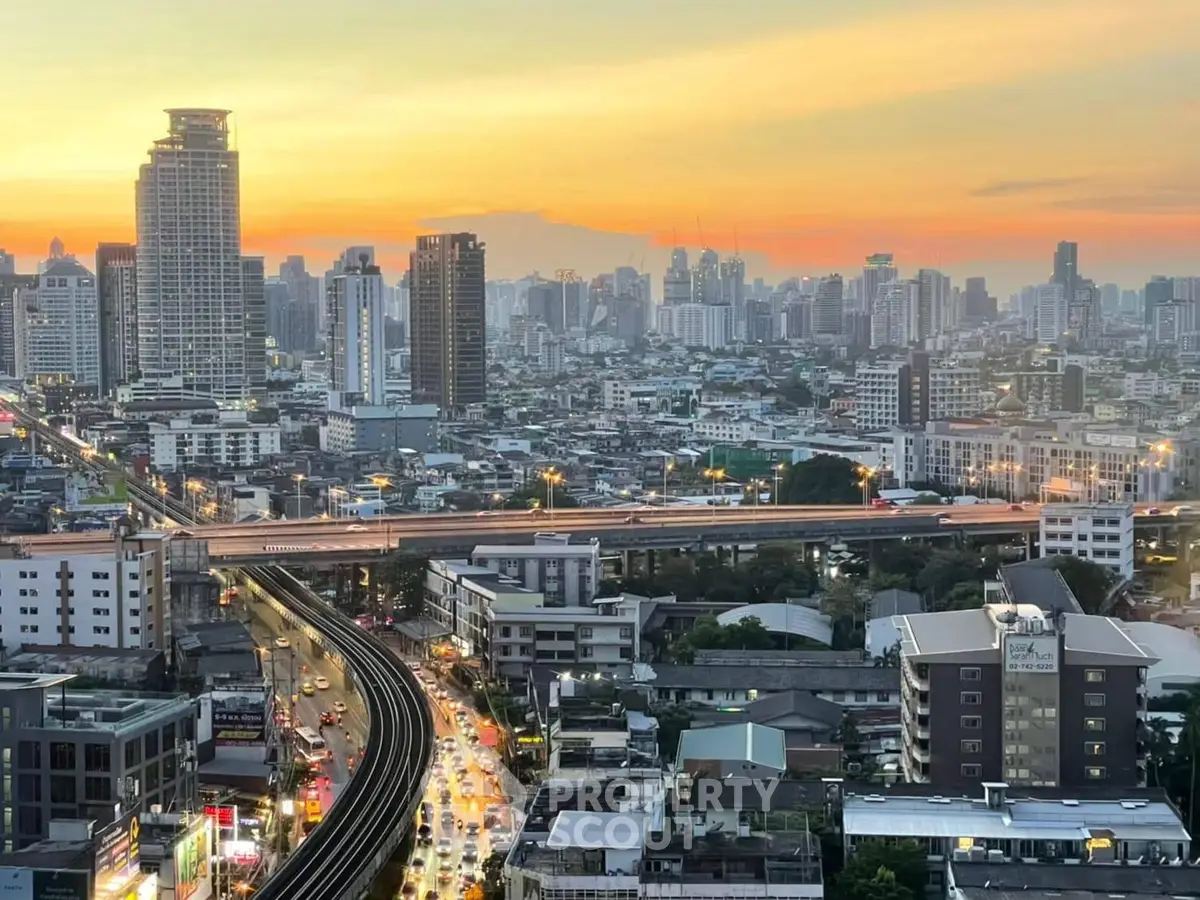 Stunning cityscape view showcasing vibrant urban skyline at sunset, perfect for high-rise living enthusiasts.
