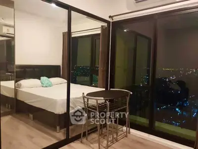 Modern bedroom with city view and mirrored closet doors