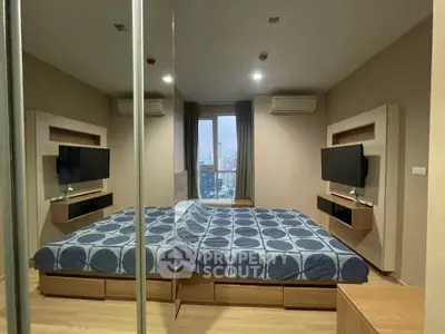 Modern bedroom with mirrored wall and city view, featuring sleek design and comfortable bedding.