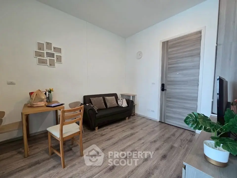 Cozy living room with modern decor and wooden flooring, perfect for relaxation and entertaining.
