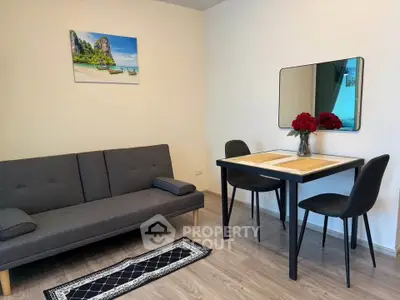 Cozy living room with modern furniture and elegant decor, perfect for relaxation and dining.